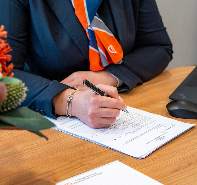 funeral director doing paperwork